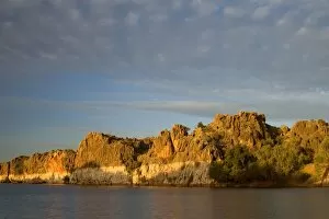 Geike Gorge - beautiful red cliffs of Geike Gorge and clouds in last evening light