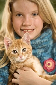 Girl & Cat - Kitten in arms of girl