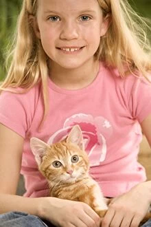Girl & Cat - Kitten in girls lap