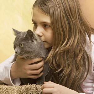Girl - cuddling grey cat