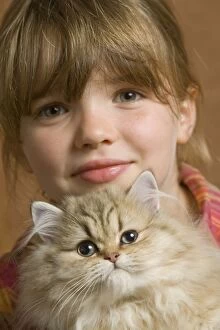 Images Dated 9th September 2007: Girl - cuddling Persian Kitten