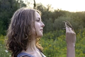 Girl - holding captured Reed Warbler
