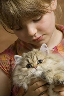 Images Dated 9th September 2007: Girl - holding Persian Kitten