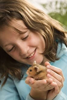 Girl - holding pet hamster