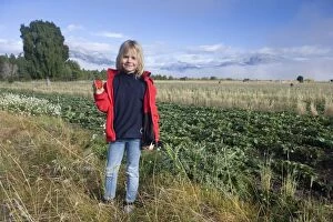 Arable Gallery: Girl - standing beside a strawberry field showing