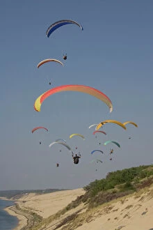 Group of paragliders over the Bassin d'Arcachon