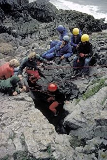 Group of young people caving