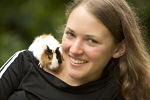 Images Dated 25th June 2005: Guinea Pig - on girl's shoulder