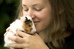 Images Dated 25th June 2005: Guinea Pig - being held by girl