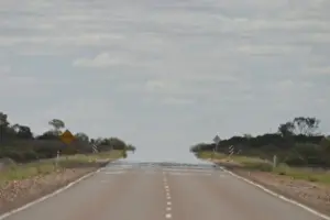 Road Prints: Heat Haze Heat haze merges the road with the sky in outback Australia near Coober Pedy