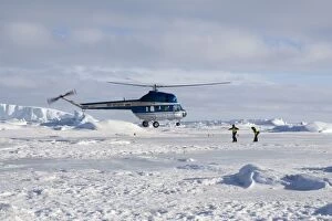 Images Dated 25th October 2006: Helicopter from cruise ship landing on sea ice Weddle sea