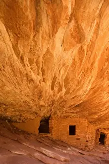 House on Fire Ruin - ancient puebluan dwelling built into an alcove in Mule Canyon. There is an intricate pattern visible on the ceiling of the alcove which, in reflected light, look like flames, giving the ruin its name - Mule Canyon, Cedar Mesa