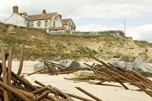 Images Dated 21st April 2008: Houses on cliff edge and remains old sea defences after severe coastal erosion Happisburgh North