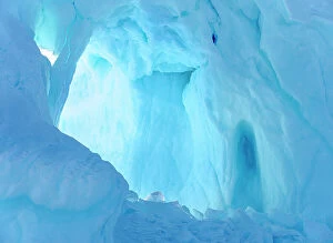 Uummannaq Collection: Iceberg frozen into the sea ice of the Uummannaq fjord system during winter