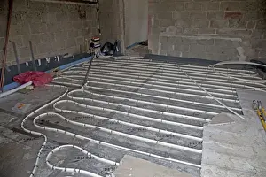 Cheltenham Prints: Installing underfloor heating pipes in new office building - Cheltenham - UK