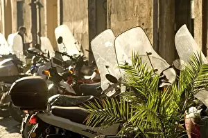Motorbike Prints: Italy - Rome - street scene with parked mopeds in sunlight