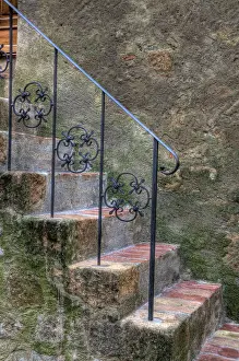 Village Prints: Italy, Tuscany, Pienza. Steps with wrought iron railing leading to the entrance to a home in Pienza
