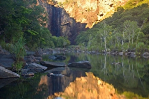 Jim Jim Falls - water of famous Jim Jim Falls plunges down into a deep pool surrounded by spectacular 150 m high cliffs Jim Jim Falls - water of famous Jim Jim Falls plunges down into a deep pool surrounded by spectacular 150 m high cliffs