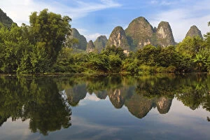 Karst formations reflected on Yulong River