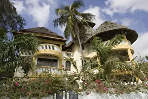 Sale Prints: Kenya - Traditional style thatched house on waterfront Lamu, Kenya