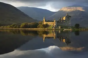 November Prints: Kilchurn Castle in beautiful evening light reflected in Loch Awe - November - Scotland