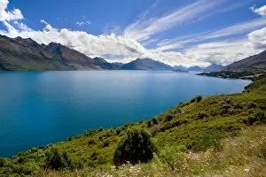 Lake Wakatipu - surrounded by stunning mountains with dispersing clouds after a heavy thunderstorm