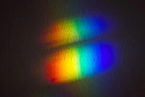 Light refraction on the wall. Spectrum of colours