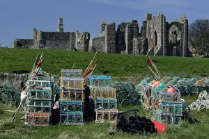 Commerical Prints: Lindisfarne, Holy Island-Lobster pots in front of monasty ruins, Northumberland UK
