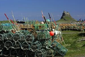 Lindisfarne, Holy Island - stacked lobster pots and view of castle