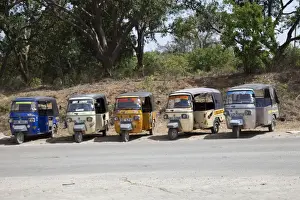 Streets Prints: Line of Tuk-Tuk three wheeled motorised rickshaw taxis waiting for passengers Kilifi - Kenya