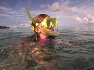 Child Gallery: Little girl snorkeling in the shallows. The waters