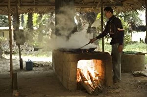 Local man boiling Palm sugar liguid - evaporated