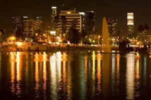 Los Angeles - at night - reflections in park's lake illuminating a fountain and skyscrapers - Los Angeles, California, USA