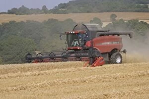 MAB-85 Red combine harvester working in Cotswolds