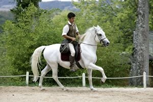 Man riding Horse - training for Falconry