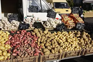 Garlic Prints: Market - Vegatable stall selling garlic and a variety of potatoes. Nice - France