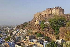 Mehrangarh Fort on hill above modern day