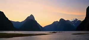 Tranquillity Collection: Milford Sound with landmark Mitre Peak and surrounding mountains just after sunset