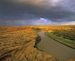 Stormy Gallery: The Milk River runs through badlands of