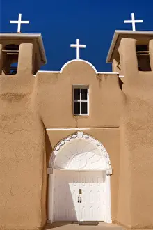 Mission San Francisco de Asis - front with entrance portal of this beautiful mission in adobe building style - Rancho de Taos, New Mexico, USA