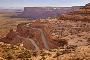 Mokey Dugway - view onto the switchbacks of gravel road UT261, carved into the flanks of the cliff Mokey Dugway - view onto the switchbacks of gravel road UT261, carved into the flanks of the cliff