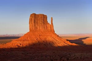 Monument Valley - famous sandstone butte West Mitten. In late evening light