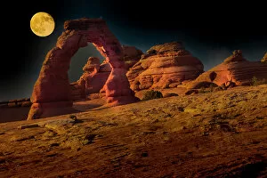 Images Dated 14th April 2022: Full moon over Delicate Arch. Arches National Park. Utah, USA. Date: 18-07-2021