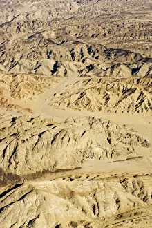 Dolerite Prints: The Moon Valley from the air - landscape showing folded marbles gneisses