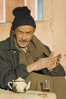 Images Dated 31st January 2005: Morocco - A Berber in Tafraoute enjoys a mint tea