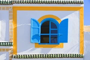 Images Dated 18th February 2006: Morocco - brightly coloured house wall & window