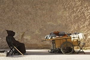 Images Dated 18th January 2009: Morocco - Old man and his handcart with woollens