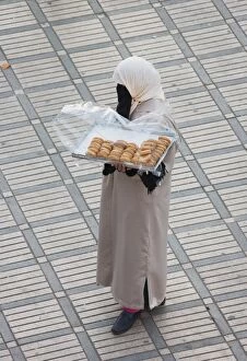 Images Dated 8th February 2007: Morocco - Woman selling cookies at Marrakesh's
