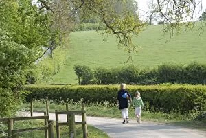 Images Dated 28th April 2011: Mother and daughter - walking down country road