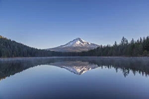 Mount Hood reflects into calm waters of
